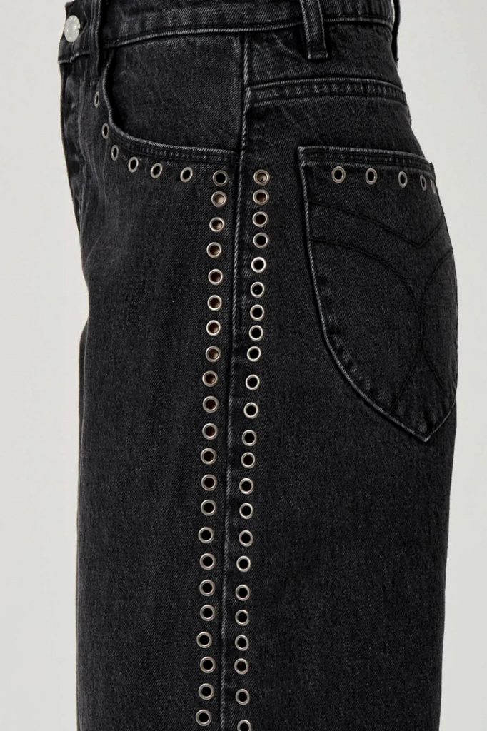 Washed black denim jeans with eyelet detailing