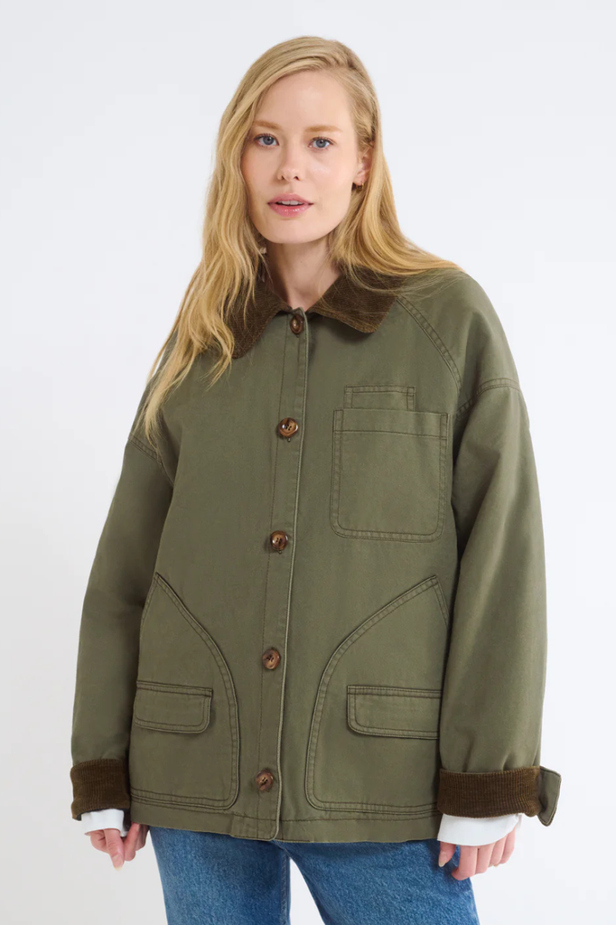 Green cotton barn jacket with brown corduroy collar and cuffs.