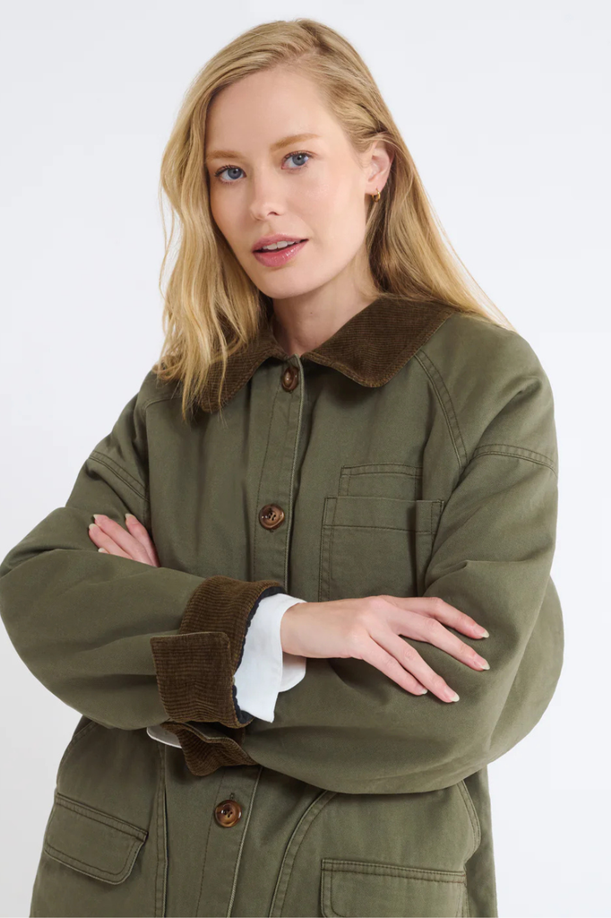 Green cotton barn jacket with brown corduroy collar and cuffs.