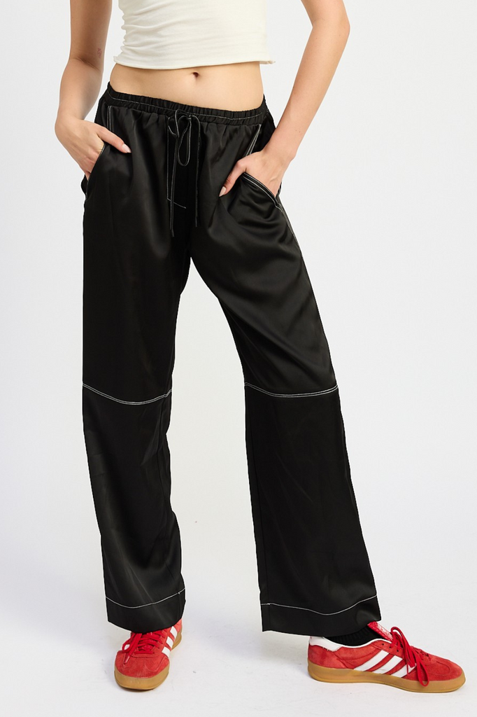 black satin pants with white contrast stitch