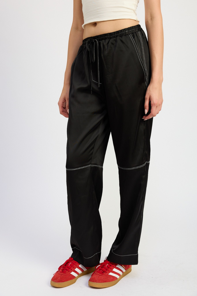 black satin pants with white contrast stitch