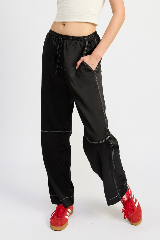 black satin pants with white contrast stitch