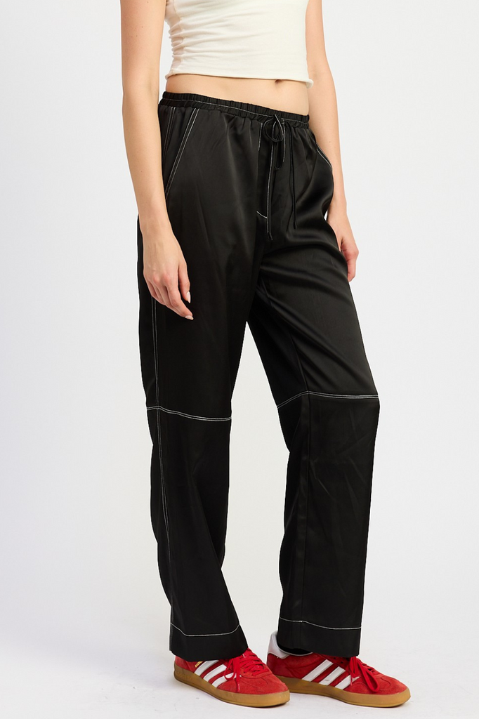 black satin pants with white contrast stitch