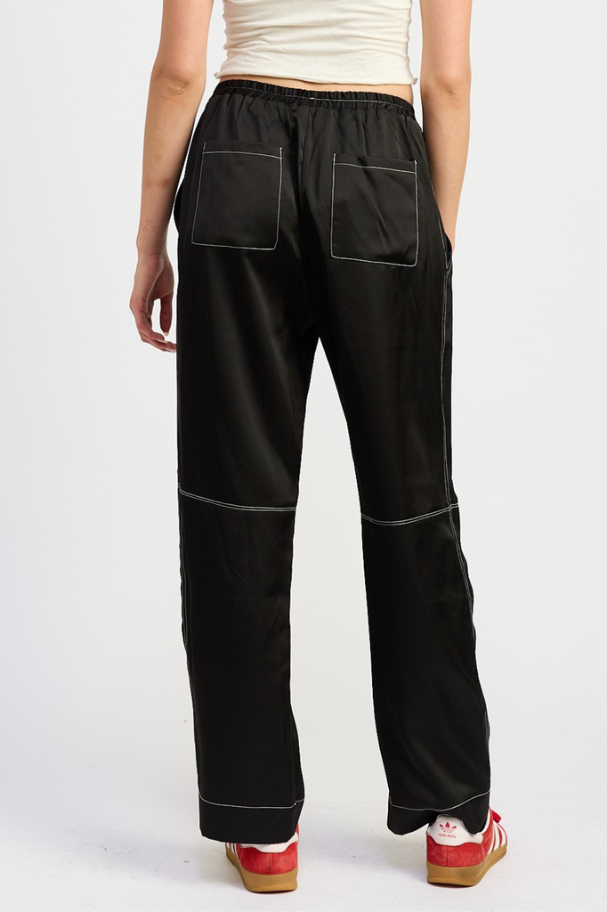 black satin pants with white contrast stitch