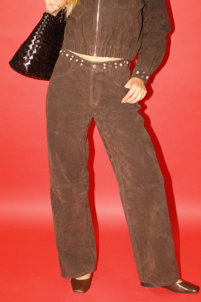 Brown faux leather wide leg pants, waistband embellished with studs and grommets