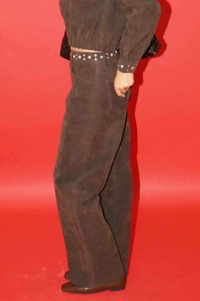Brown faux leather wide leg pants, waistband embellished with studs and grommets