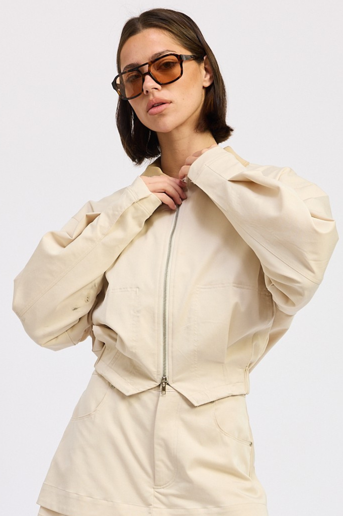 Light beige boxy fit zip-up jacket with tan collar.