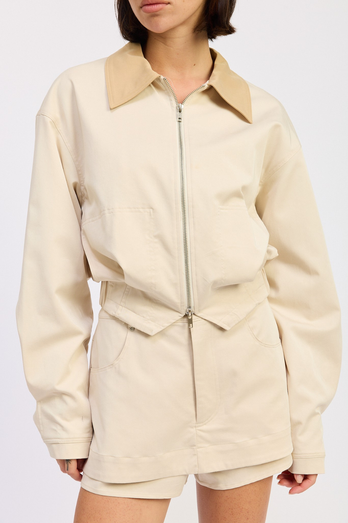 Light beige boxy fit zip-up jacket with tan collar.