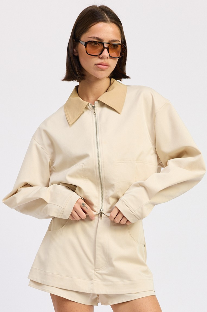 Light beige boxy fit zip-up jacket with tan collar.