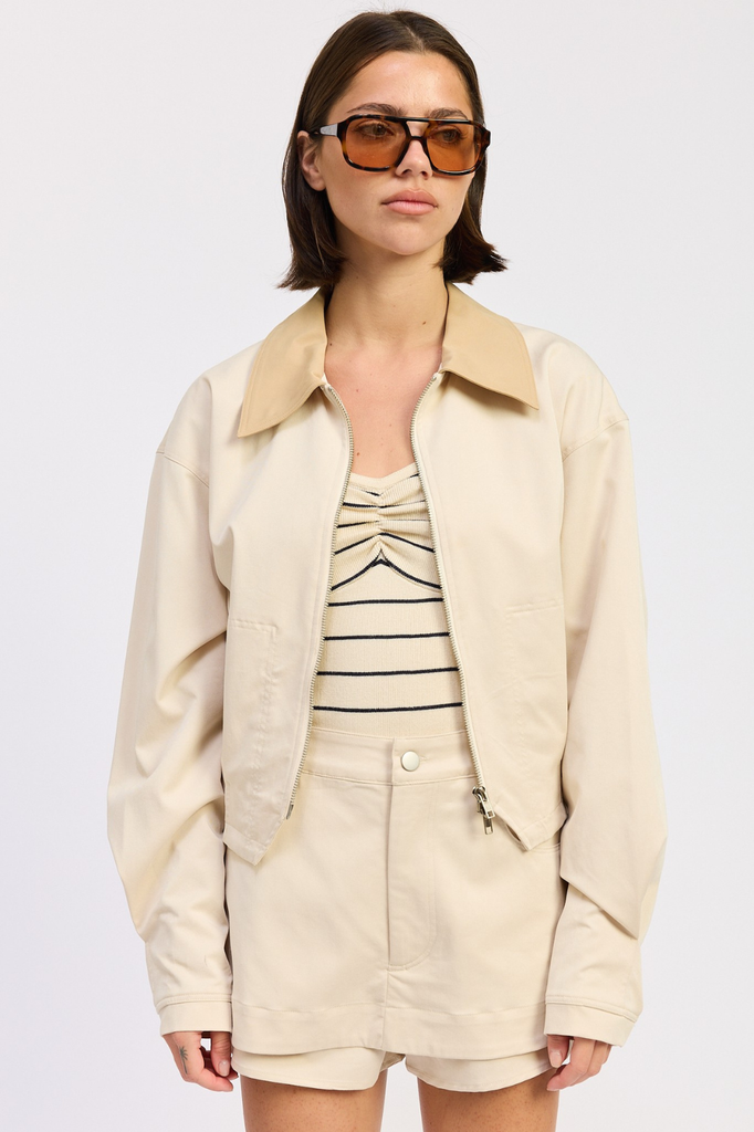 Light beige boxy fit zip-up jacket with tan collar.