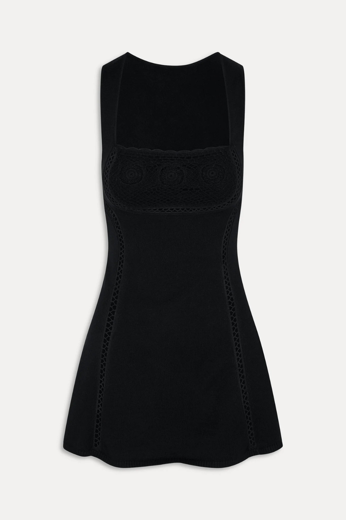 Sleeveless little black mini dress with peekaboo stitching detail throughout