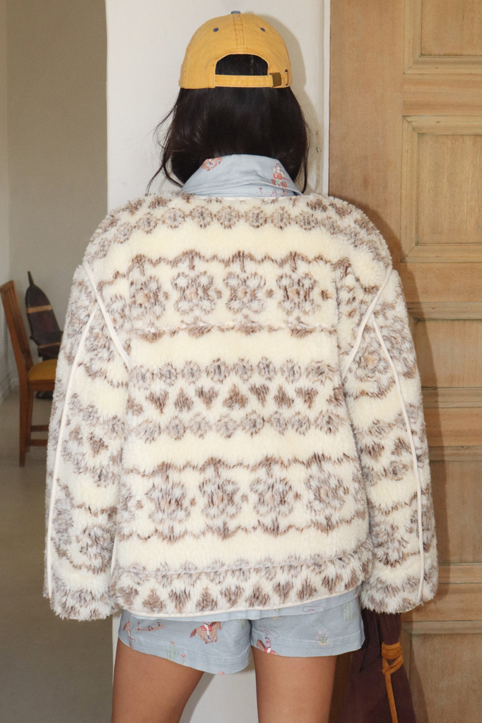 Creamy colored fuzzy zip-up sherpa jacket with a brown tonal fair isle pattern