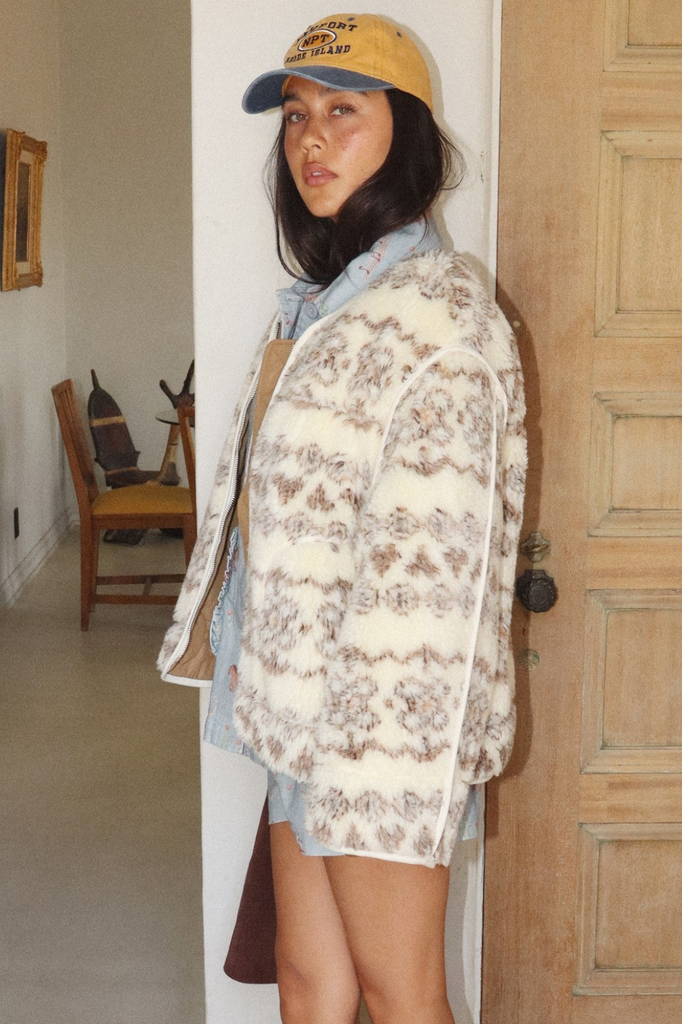 Creamy colored fuzzy zip-up sherpa jacket with a brown tonal fair isle pattern