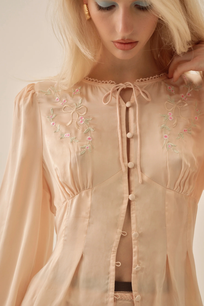 Vintage-inspired satin blouse with dainty floral embroidery