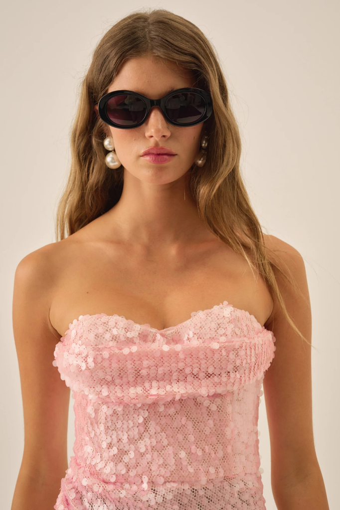 Festive strapless sequined mini dress with a draped cowl neckline