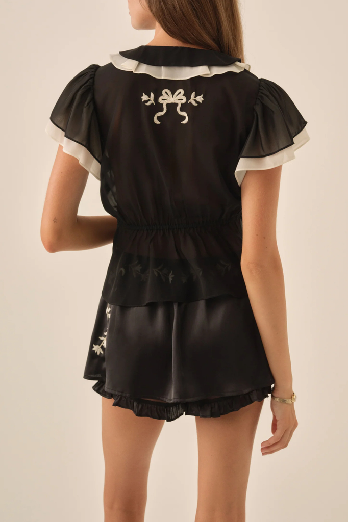 Black satin chiffon mini skirt with floral embroidery and shorts lining