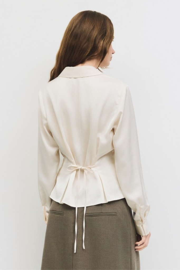 Cream button-down womens blouse with pleats and tapered waist