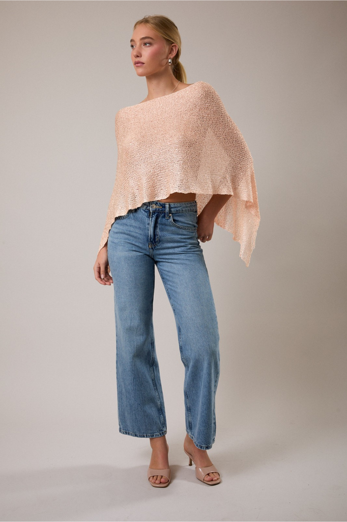 Loose knit light peach poncho with micro sequins