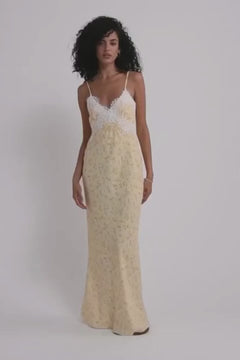 model wearing Buttery yellow floral crêpe de chine maxi dress with delicate lace trimmings