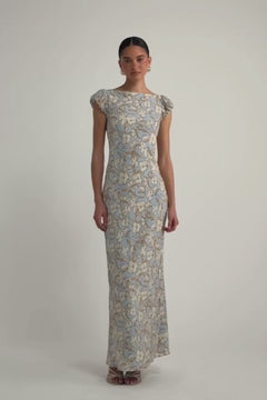 Video of model wearing light gray/blue Vintage-inspired floral vine maxi dress with an open back