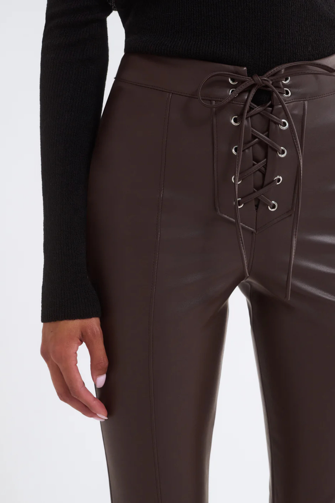 Dark brown pants in a stretchy, fitted faux leather