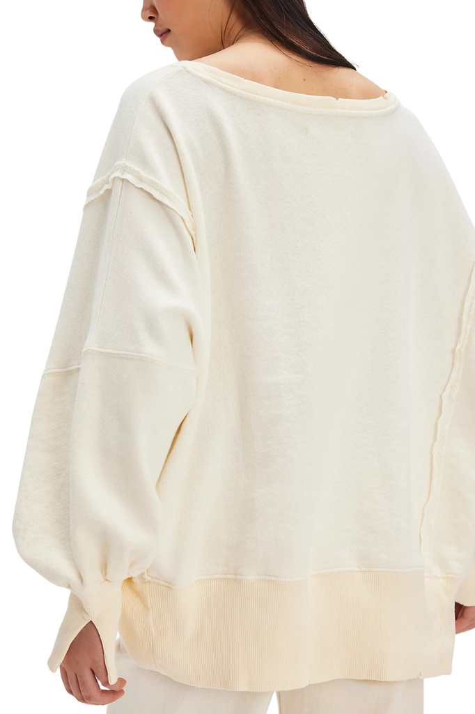 relaxed fit off-white sweater top with a printed Sardine scene